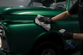 Professional water spot removal treatment on a classic 1960s vintage truck